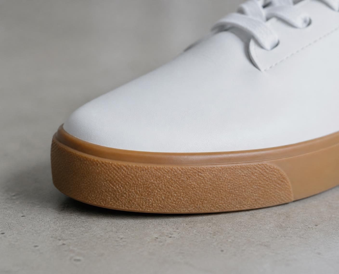 A white sneaker with a gum sole (a generated photo)